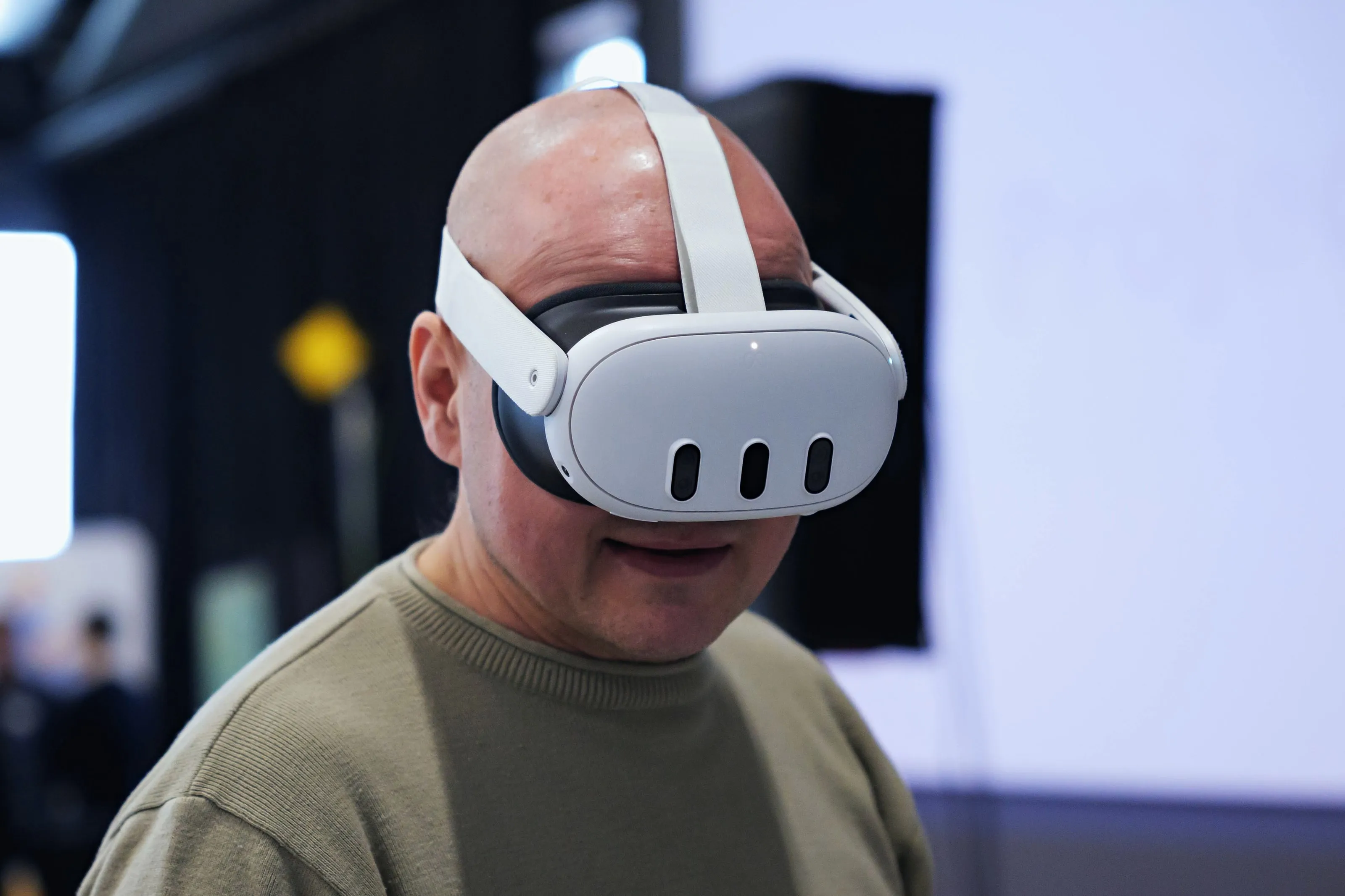 An employee wearing a VR headset, immersed in virtual safety training