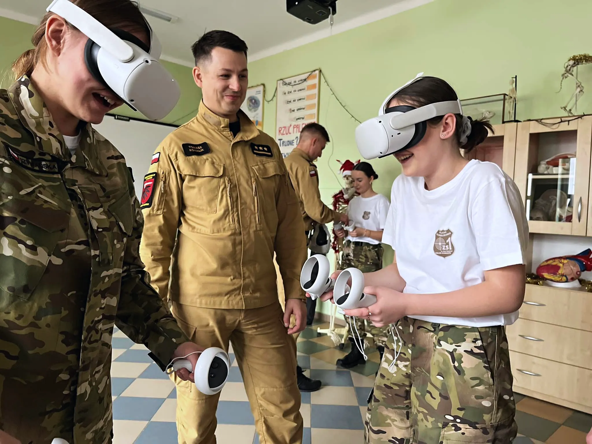 Children participating in fire safety training with the help of a firefighter, wearing VR headsets